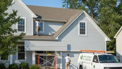 Vinyl siding installation on residential home exterior in Cleveland, OH by local siding contractors
